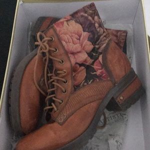 Leather boots with a floral pattern